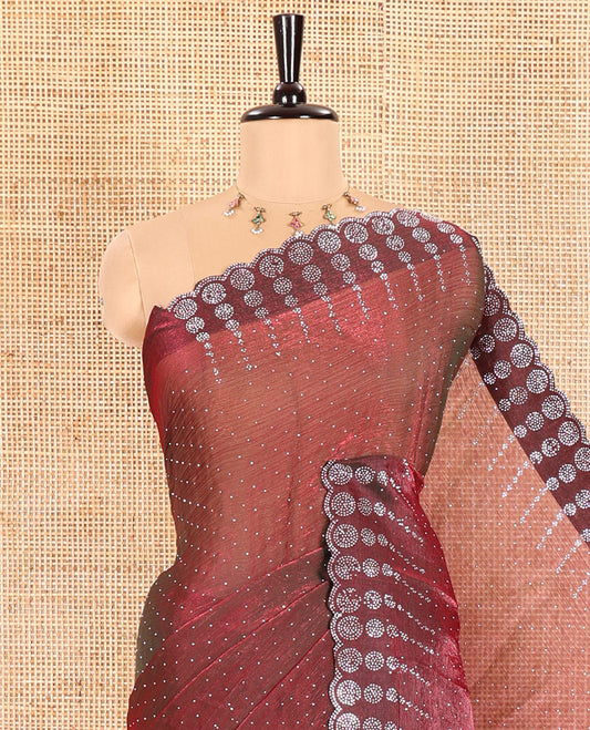 Wine Fendi Chiffon Saree Sparkled With Glittering Swarovski Stones Struck All Over Its Body, Complemented With Scallop Swarovski Stone Work Border, Swarovski Stone Work Pallu, And A Matching Swarovski Stone Work Blouse