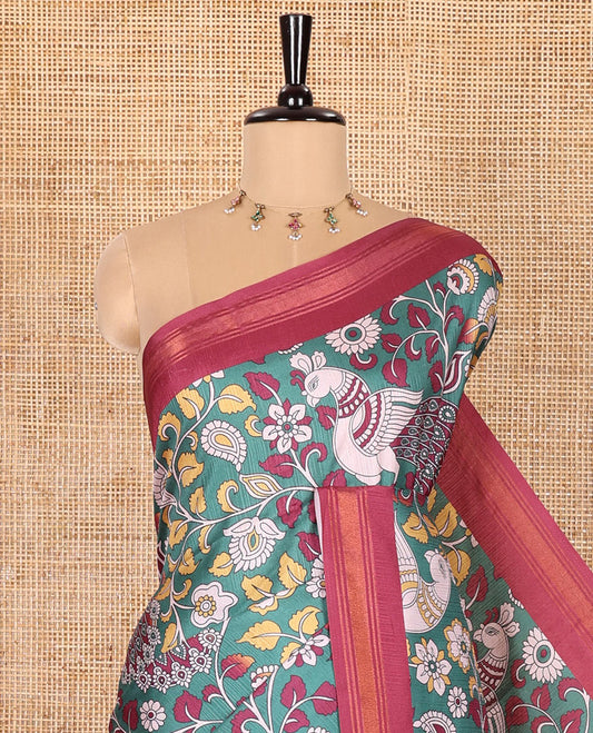 Dark Green Manipuri Silk Saree, Accentuated with Kalamkari-Style Floral Vine and Peacock Motifs Printed All Over Its Body, Complemented by a Contrast Zari Border, Pallu of Chevron Stripes, and Paired with a Contrast Blouse
