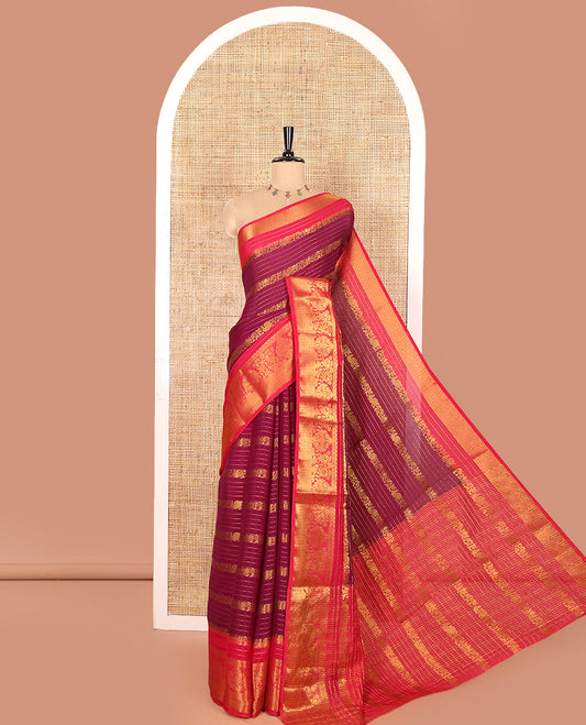 Purple Moss Chiffon Saree, Mesmerized with Horizontal Stripes, Peacock, and Floral Buttas All Over Its Body, Complemented by a Contrast Traditional Zari Border, Pallu Mirrors the Same Design, and Paired with a Contrast Floral-Paisley Blouse