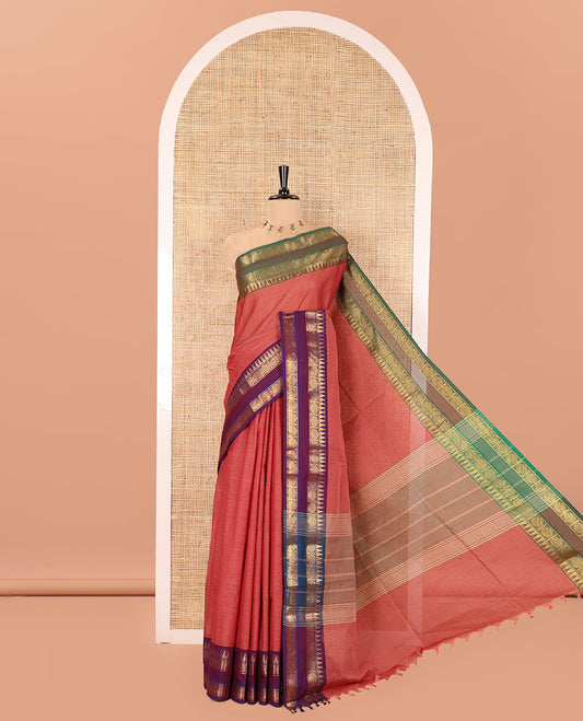 Dusky Pink Plain Chettinad Cotton Saree, Complemented by a Contrast Ganga-Jamuna Rettai Pettu Border of Temple and Rudraksham Designs, Subtly Striped Pallu, and Paired with a Matching Blouse