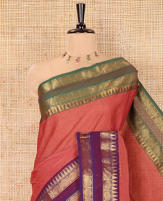 Dusky Pink Plain Chettinad Cotton Saree, Complemented by a Contrast Ganga-Jamuna Rettai Pettu Border of Temple and Rudraksham Designs, Subtly Striped Pallu, and Paired with a Matching Blouse
