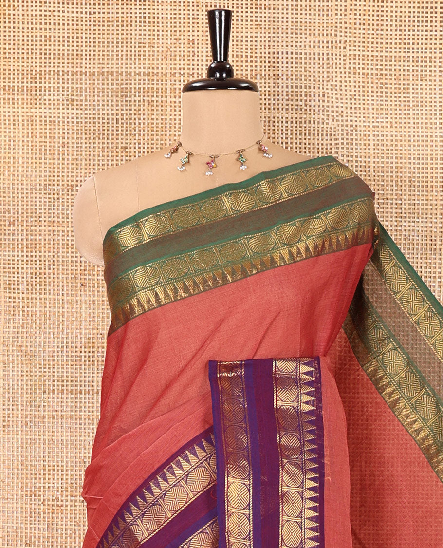 Dusky Pink Plain Chettinad Cotton Saree, Complemented by a Contrast Ganga-Jamuna Rettai Pettu Border of Temple and Rudraksham Designs, Subtly Striped Pallu, and Paired with a Matching Blouse