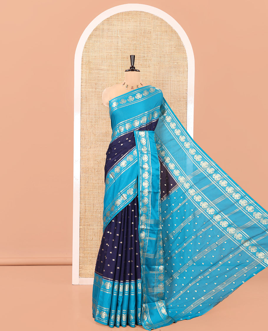 Navy Blue Art Mysore Silk Saree, Elevated with Zari Buttas All Over Its Body, Complemented by a Contrast Rettai Pettu Border of Two-Headed Eagle Designs, Pallu Steeped with Buttas and Stripes, and Paired with a Contrast Blouse