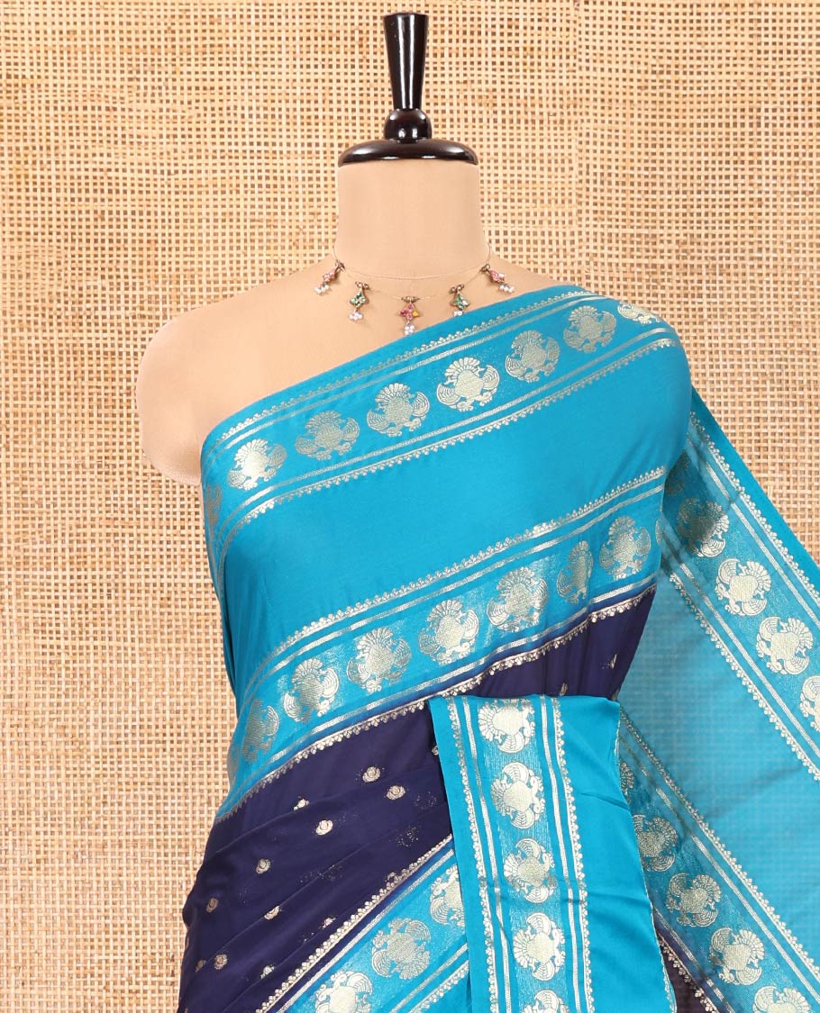 Navy Blue Art Mysore Silk Saree, Elevated with Zari Buttas All Over Its Body, Complemented by a Contrast Rettai Pettu Border of Two-Headed Eagle Designs, Pallu Steeped with Buttas and Stripes, and Paired with a Contrast Blouse