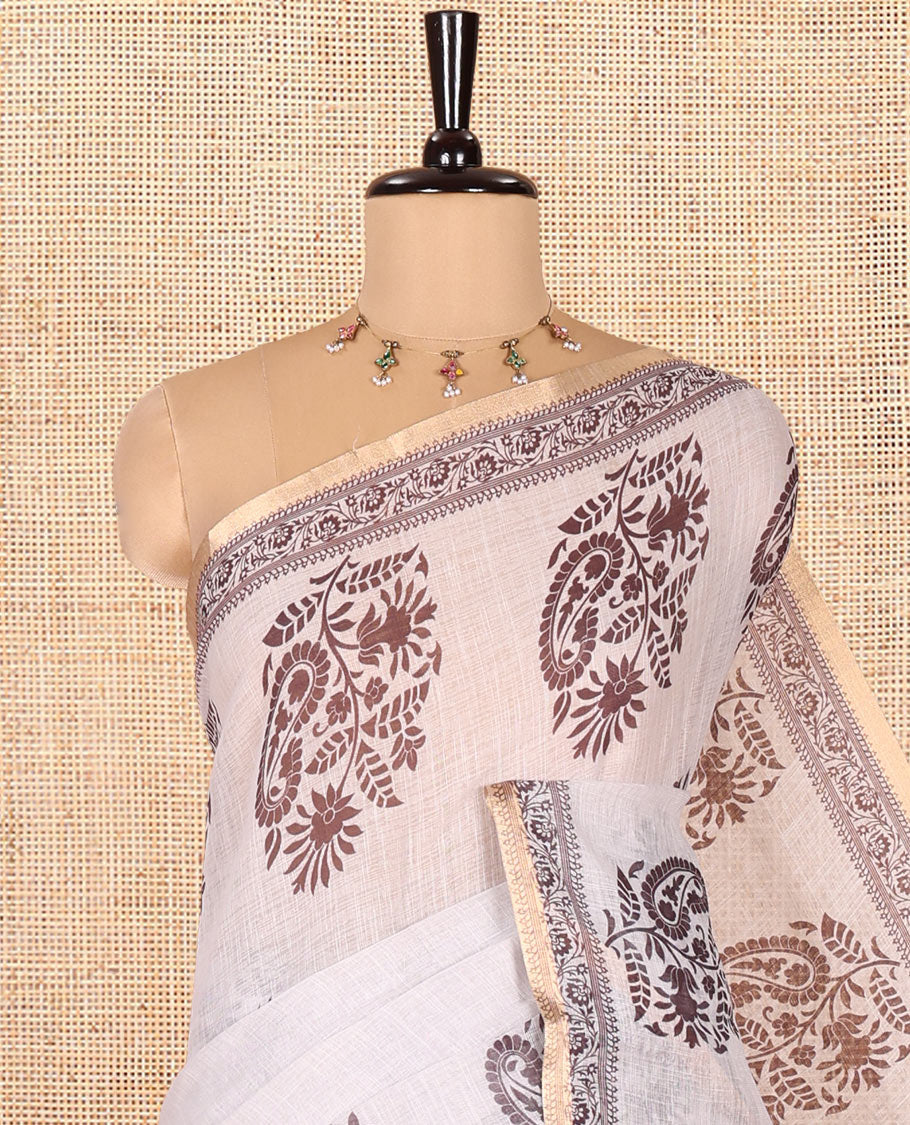 Cream Linen Cotton Saree, Decked Up with Floral-Paisley Motifs Print All Over Its Body, Highlighted by Gold Zari Printed Border, Floral-Paisley Printed Pallu and Paired with a Matching Blouse
