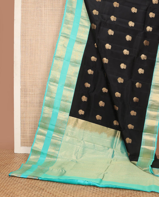 Black vasundhara elite silk saree with zari buttas, contrast intricate pallu & rettai pettu border of muthu,neli & mayil designs