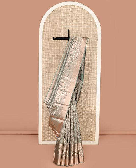 Green Kanchipuram Silk Saree Highlighted by Jacquard Design, Complemented by Zari Border of Thilakam Mokku, Manga, Jaal, and Kodi Visiry Designs, Pallu Elevated with Intricate Zari Designs, and Paired with a Matching Blouse