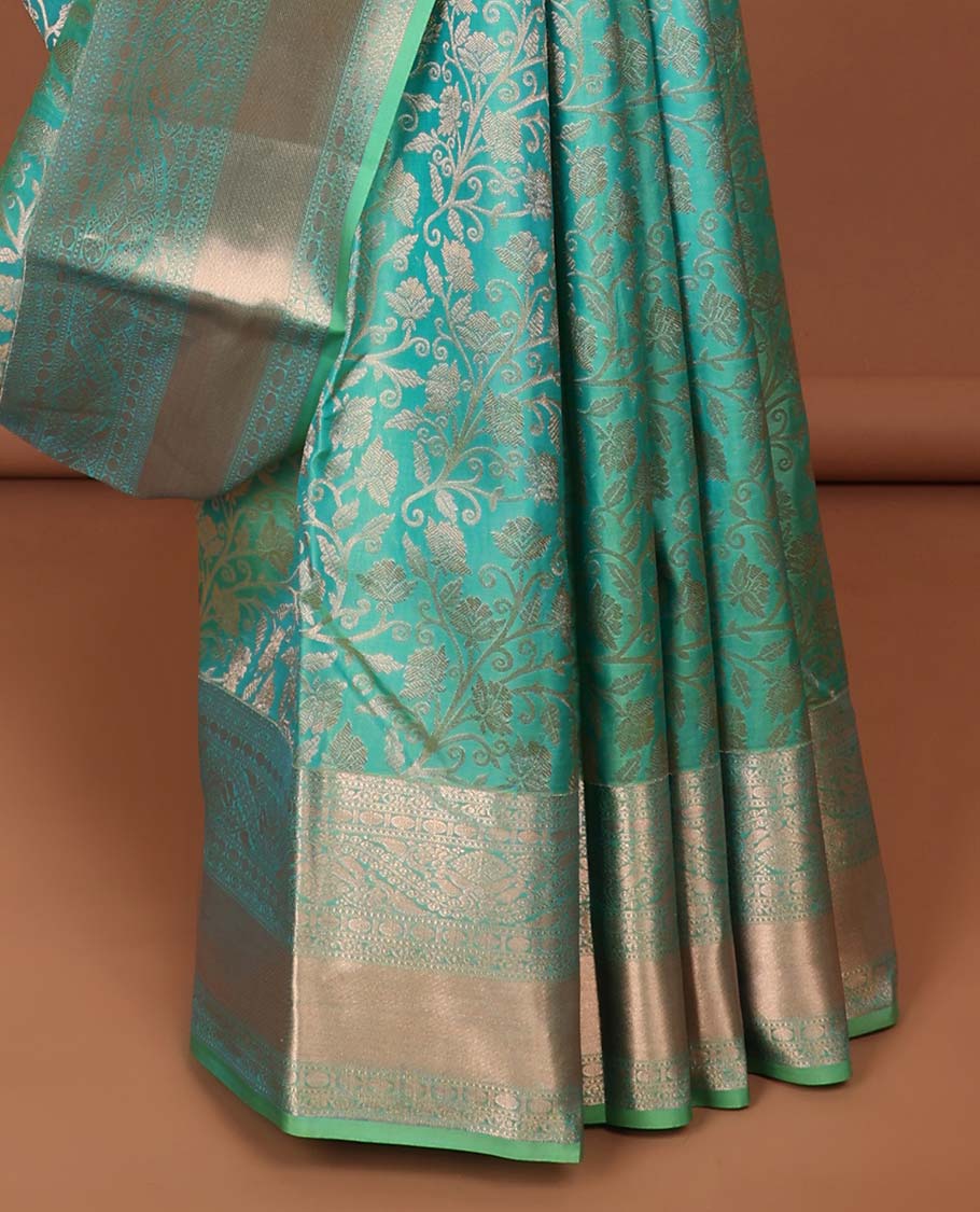 Green  jacquard kancheepuram silk saree with self floral zari border & intricate zari design pallu