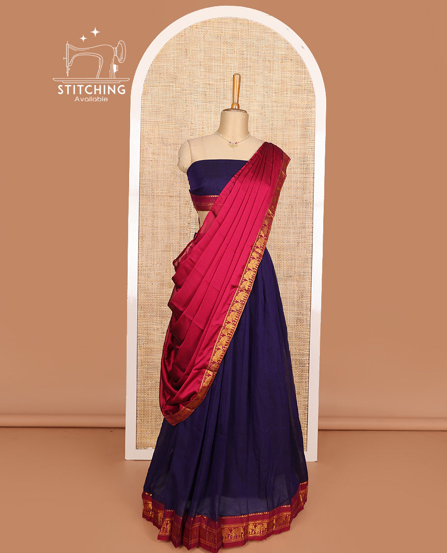 Blue cotton half-saree, plain with contrast elephant motif bordered skirt, matching blouse, and contrast elephant motif dhavani