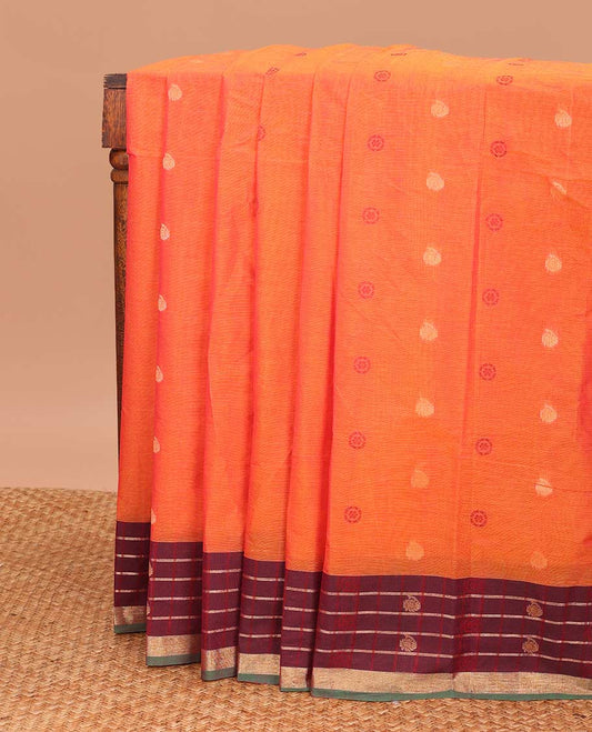 Orange chakra, and paisley buttas Coimbatore cotton saree, contrast butta enclosed checked border, and pallu of paisleys and chevron design