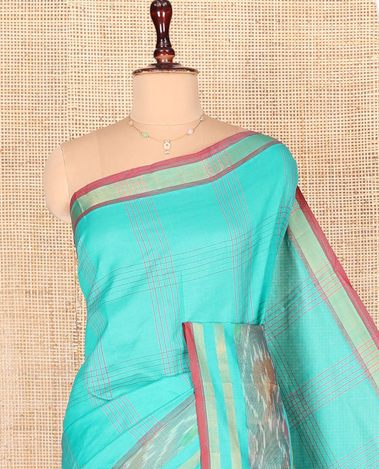Turquoise Kuppadam Cotton Saree, Subtly Sparkled with Checked Designs on Its Body, Highlighted by Ikkat-Textured Border, Complemented by Contrast Pallu, and Paired with a Contrast Blouse