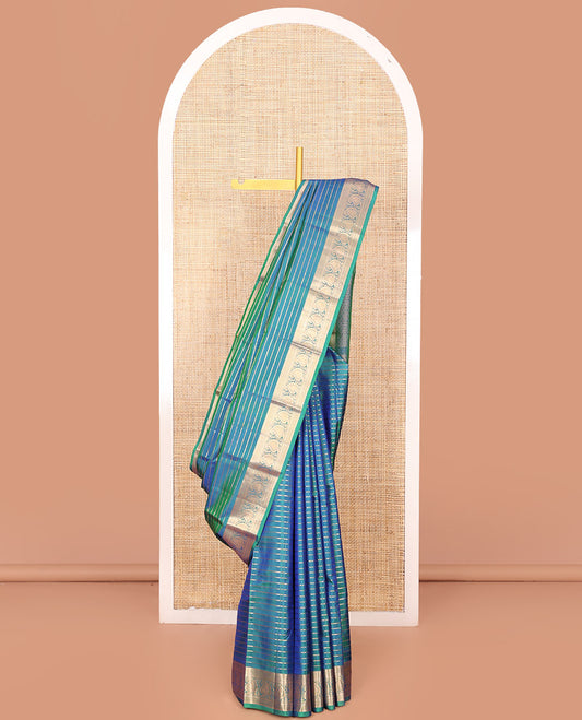 Blue Vasundhara Silk Saree Richly Detailed with Zari Buttas, Highlighted by a Zari Border of Rekku, Kuyil Kann, Neli, and Manga Designs, Delicately Woven Pallu of Jaal Designs, and Paired with a Matching Blouse