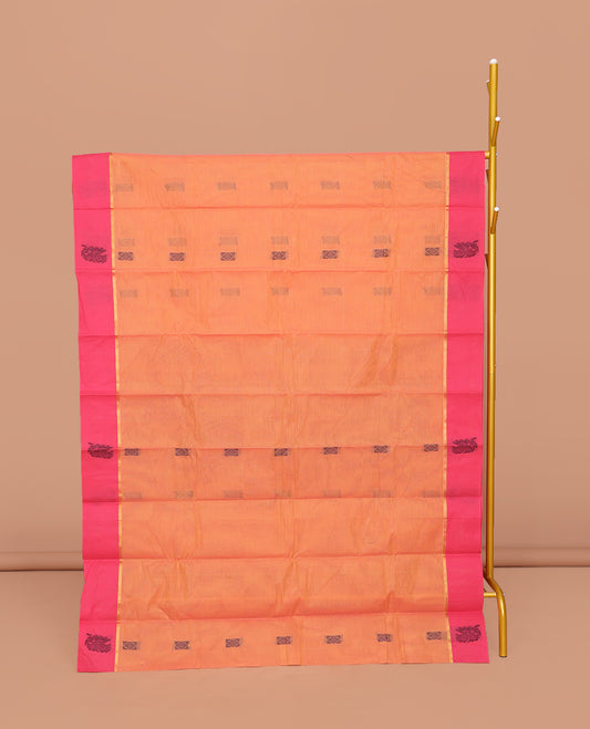 Orange Kanchi Cotton Saree, Decked Up with Buttas All Over Its Body, Complemented by a Contrast Floral  Border, Pallu of Floral Designs, and Paired with a Matching Blouse