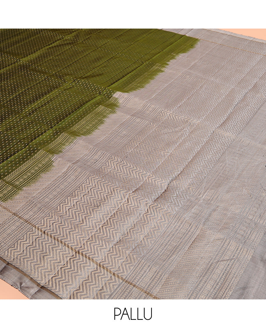 Green Mayuri Soft Silk Saree, Steeped with Buttas All Over Its Body, Complemented by Contrast Border, Pallu of Chevron Stripes, and Paired with a Contrast Blouse