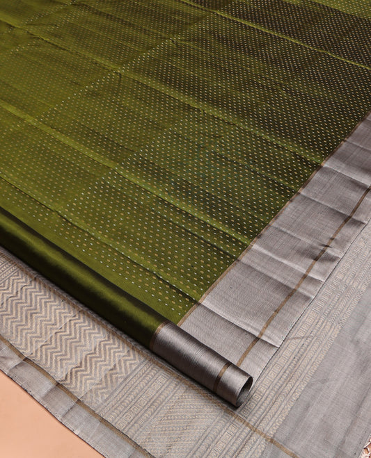 Green Mayuri Soft Silk Saree, Steeped with Buttas All Over Its Body, Complemented by Contrast Border, Pallu of Chevron Stripes, and Paired with a Contrast Blouse