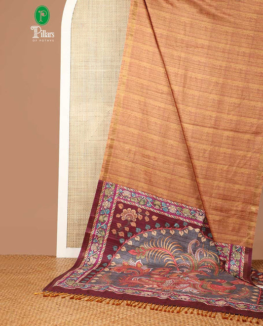 Mustard semi kicha tussar saree with small zari border & kalamkari pallu along with floral printed blouse