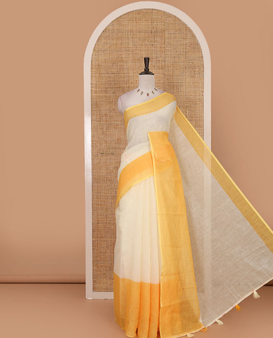 Cream full-plain linen saree, contrast yellow big plain border, plain pallu & buttas printed matching blouse