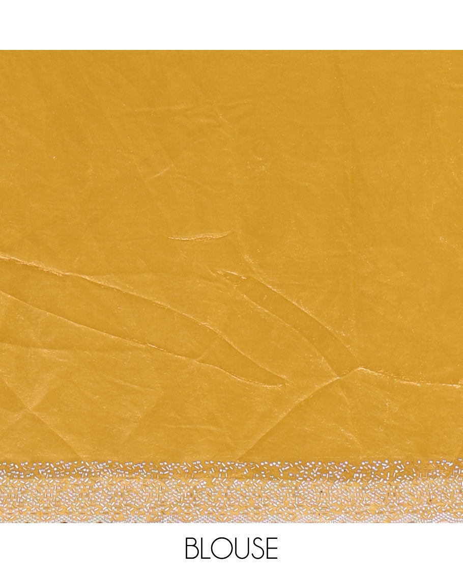 Mustard Swarovski crystal stone embedded fendy chiffon saree, scallop Swarovski stone embroidered border, and contrast plain blouse