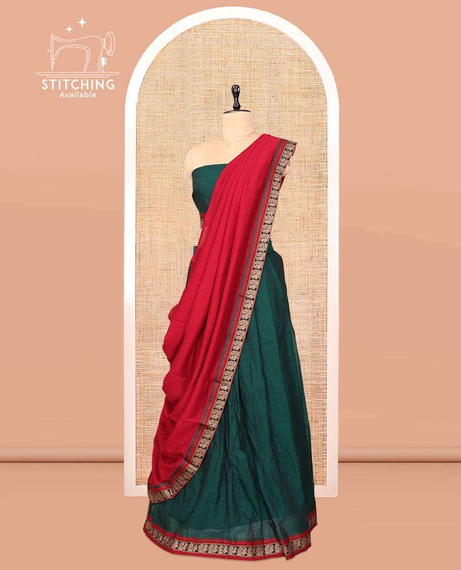 Green Cotton Half-Saree Features Plain Skirt, a Contrast Peacock Border, a Matching Blouse, and a Contrast Dhavani