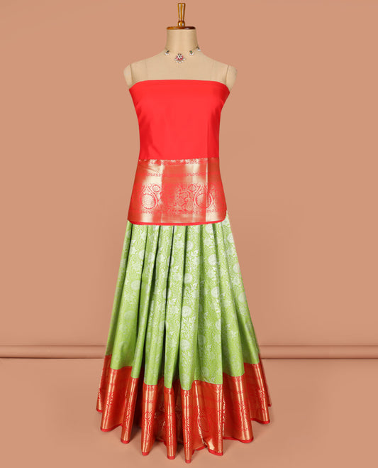 Light Green Art Silk Material Half Saree Set Featuring Floral Jacquard Skirt, a Contrast Traditional Zari-Design Border, a Zari-Bordered Blouse, and a Dhavani Elevated with Floral Zari Designs