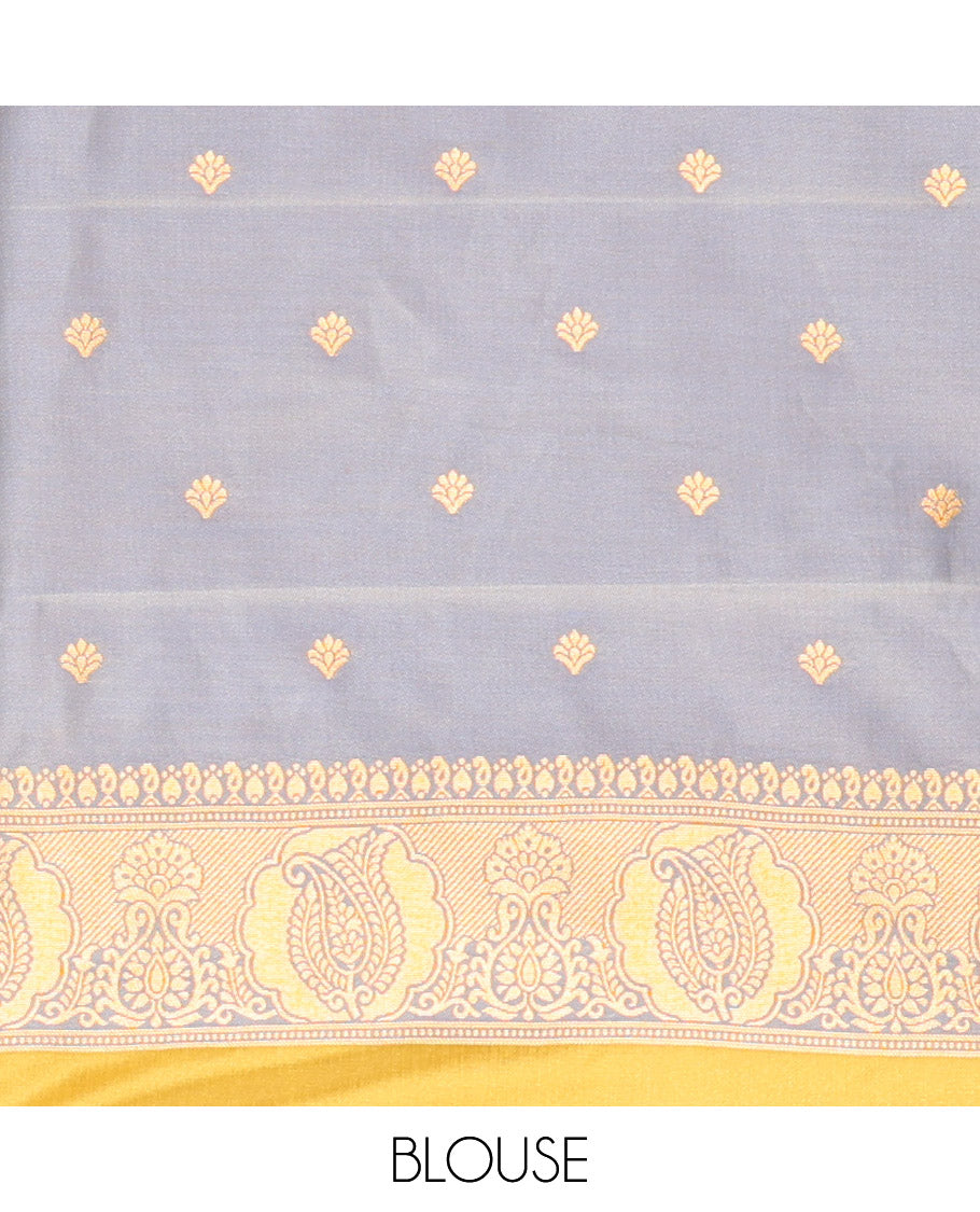 Mehendi Green Kanchi Soft Silk Saree, Majestically Detailed with Vaira Oosi, and Zari Buttas All Over Its Body, Complemented by Contrast Border of Paisleys, an Intricately Designed Pallu, and Paired with a Contrast Blouse
