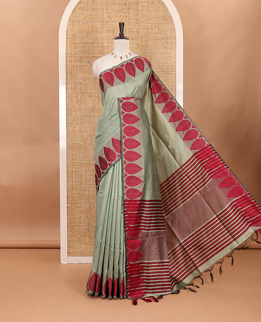 Pista green plain jute cotton saree , contrast leaf thread butta border & lining seer pallu with tussels