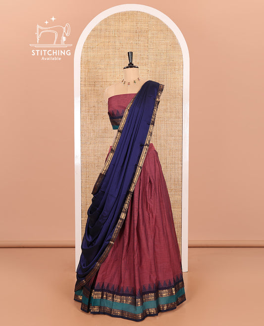 Dark Onion Pink-Navy Blue Chettinad Cotton Half-Saree Featuring a Plain Skirt, Highlighted with a Contrast Traditional Zari Rettai Pettu Temple Border, a Subtly Woven Matching Blouse, and a Vichitra Silk Contrast Traditional Zari-Bordered Dhavani