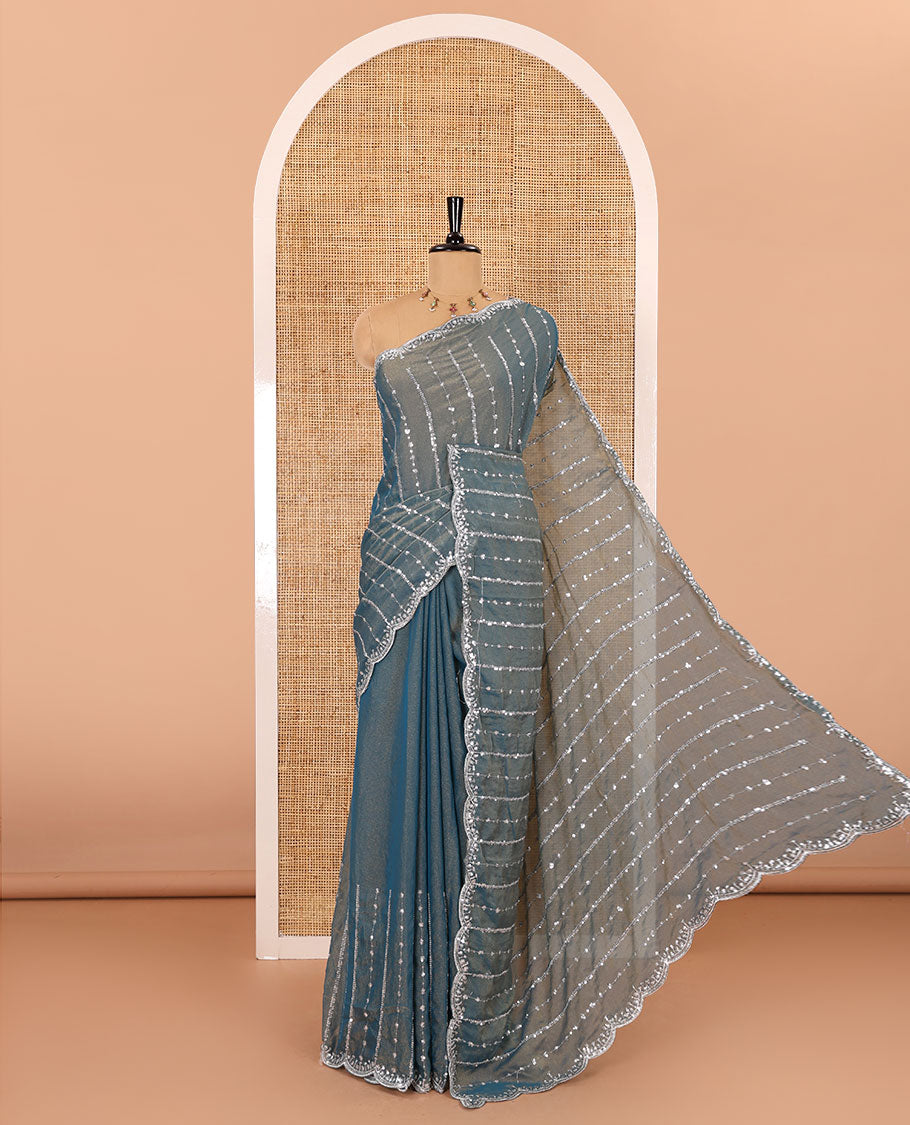 Blue vertical stripes embroidered shimmer chiffon saree, scallop embroidered border, embroidered pallu, and fancy embroidered matching blouse