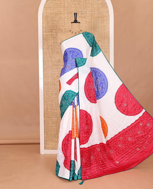 White base multi-color bandhani dots enclosed circle printed with mirror work moss chiffon saree, contrast piping border, pallu of print, stone work and mirror work