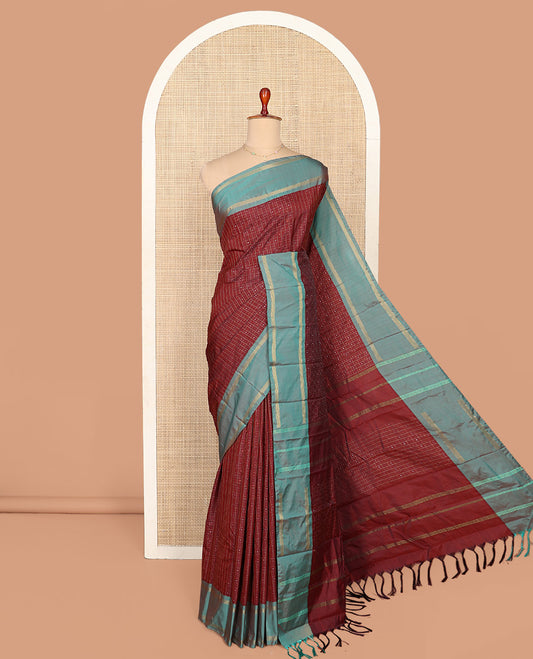 Maroon Aarani Silk Saree, Enriched with Butta Enclosed Checked Design on Its Body, Complemented by a Contrast Zari Striped Border, Pallu of Butta Enclosed Checks, and Paired with a Matching Blouse