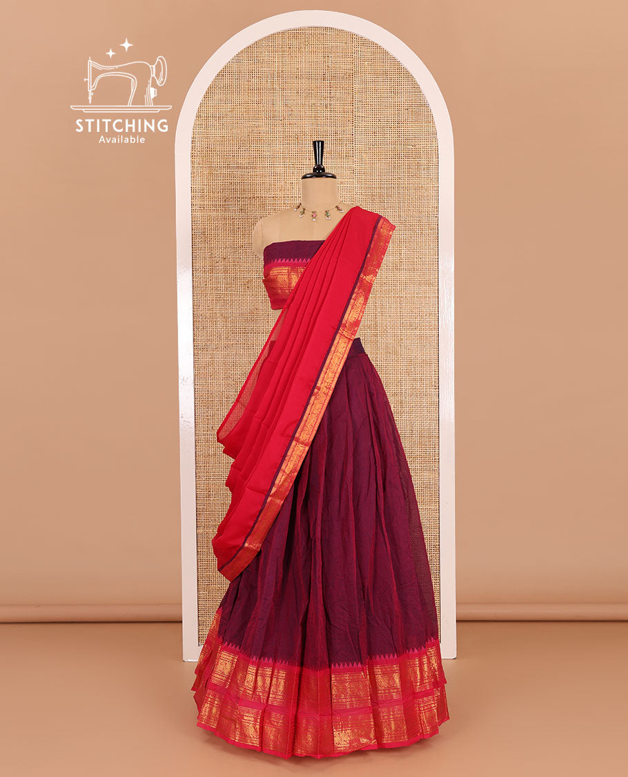 Magenta-pink sungudi cotton half-saree, plain with contrast traditional zari varisai pettu bordered skirt, a matching blouse, and a zari bordered dhavani
