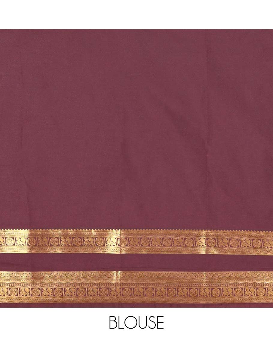 Brown Kanchipuram budget silk saree elevated with zari designs all over its body, complemented by rettai pettu traditional zari design border, Mughal-style intricately woven pallu, and paired with a Matching blouse