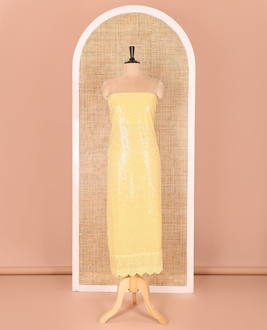 Yellow Material Chudidar Set Features Sequin Embroidered Georgette Top, a Plain American Crepe Bottom, and a Scallop Dupatta Embellished with Floral Vine Embroidery