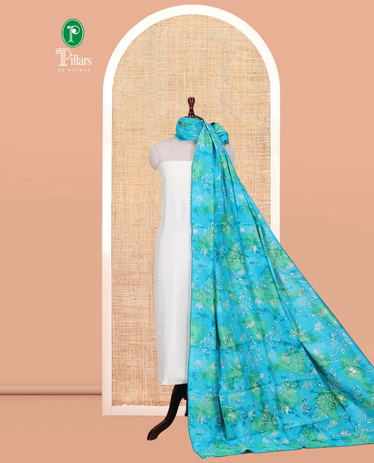 Cream-Rama Blue Kerala Cream Mul Chanderi Material Churidar Features Pom-Pom Neckline Top, a Contrast Batik Floral Printed Bottom, and  Dupatta