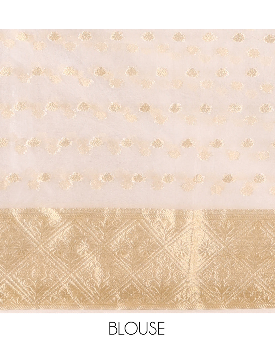Cream Semi-Organza Saree, Mesmerized with Zari Buttas All Over Its Body, Highlighted by a Zari Jaal-Patterned Border, Gleaming Zari Design Pallu, and Paired with a Matching Blouse