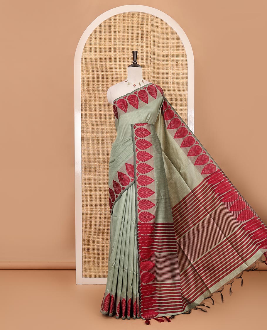 Pista green plain jute cotton saree , contrast leaf thread butta border & lining seer pallu with tussels
