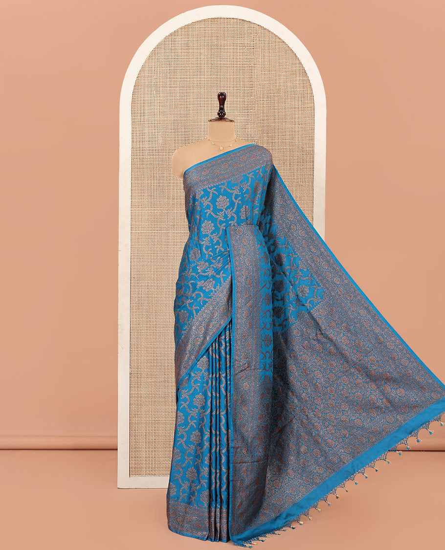 Blue Mushru Silk Saree, Mesmerized with Floral Jacquard Design on Its Body, Sparsely Sparkled Zari Border, Zari-Rich Pallu of Floral Jaal Designs, and Paired with a Matching Blouse
