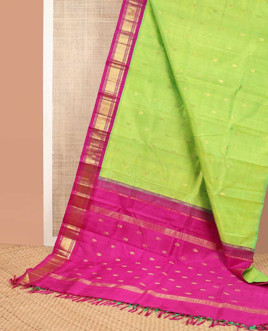 Green buttas kanceepuram silk saree with contrast korvai border of thilakam mokku, banaras design & zari design pallu