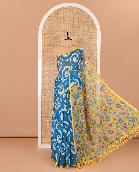 Borderless blue shibori printed linen cotton saree, contrast kaleidoscope colored kalamkari floral vine print, and a contrast printed blouse