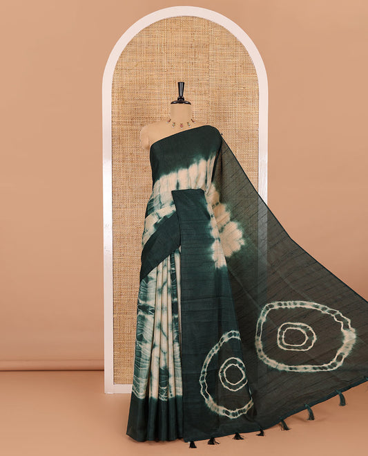 Rama green shibori printed jute cotton saree, contrast plain border, plain pallu with tussels, and contrast plain blouse