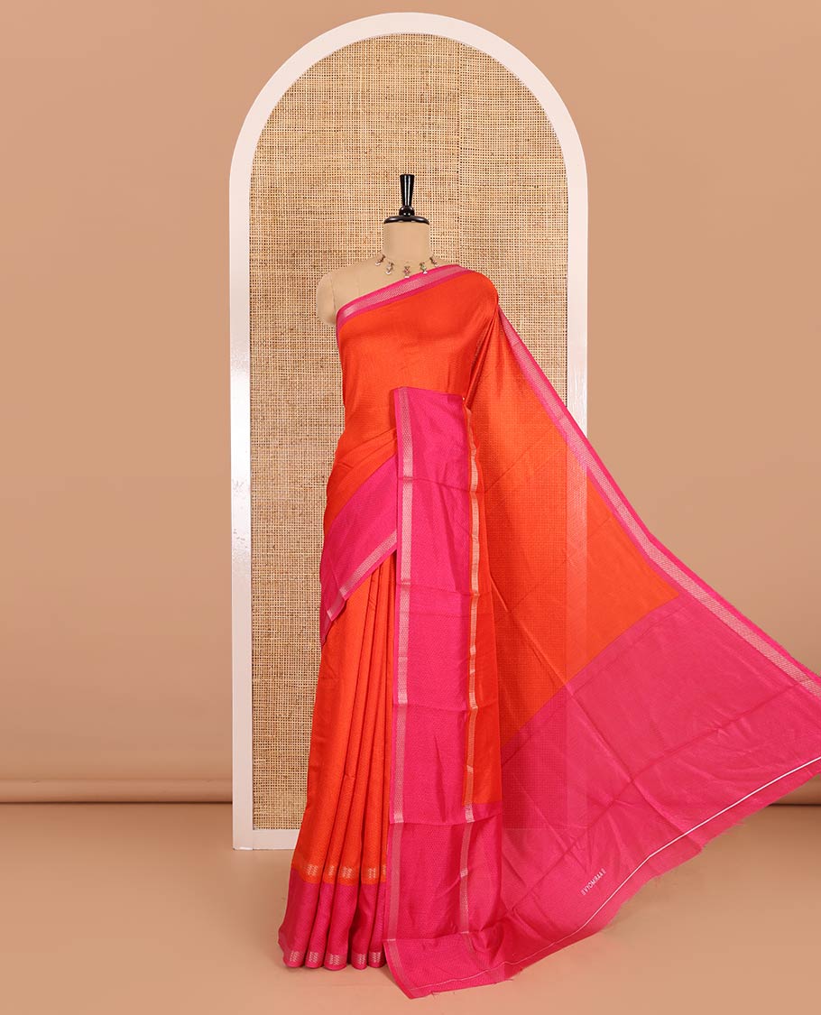 Orange embossed moss chiffon saree, contrast traditional rettai pettu border, embossed pallu, and a contrast embossed blouse