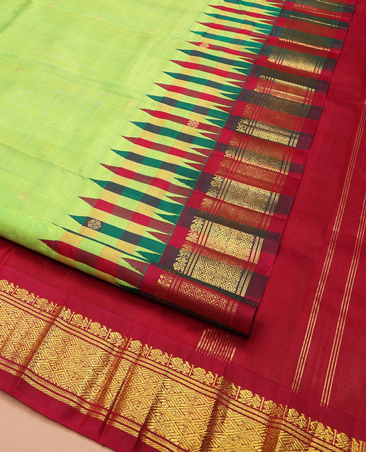 Green Kanchipuram Silk Saree, Delicately Woven with Zari Buttas on Its Body, Complemented by a Contrast One-Sided Thazampoo Rekku Border of Mayil and Jaal Designs, Pallu Depicts Zari Designs, and Comes Without a Blouse