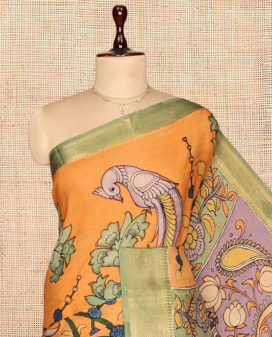 Orange Kalamkari Silk Saree, Lightly Embellished with Floral and Human Figurines, a Contrast Traditional Border, Pallu of Musical Instruments, and a Contrast Blouse