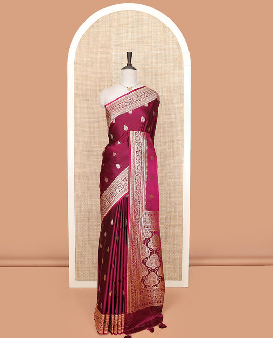 Maroon thilakam buttas banarasi silk saree, traditional zari border of floral creeper designs, and pallu of intricate designs