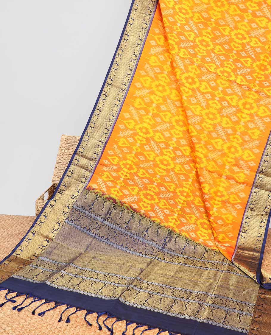 Orange ikkat style floral design soft silk saree with contrast zari border & intricate floral zari design pallu