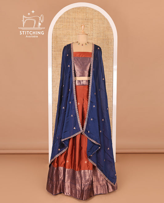 Rust taffeta silk half-saree, zari buttas and contrast traditional zari bordered skirt, a matching taffeta silk blouse, and contrast embroidered satin georgette  dhavani