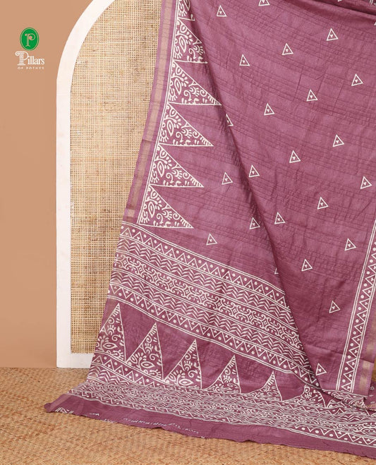 Light purple batik-style triangle motifs printed dola silk saree, batik temple motif printed piping zari border & batik geometric printed pallu