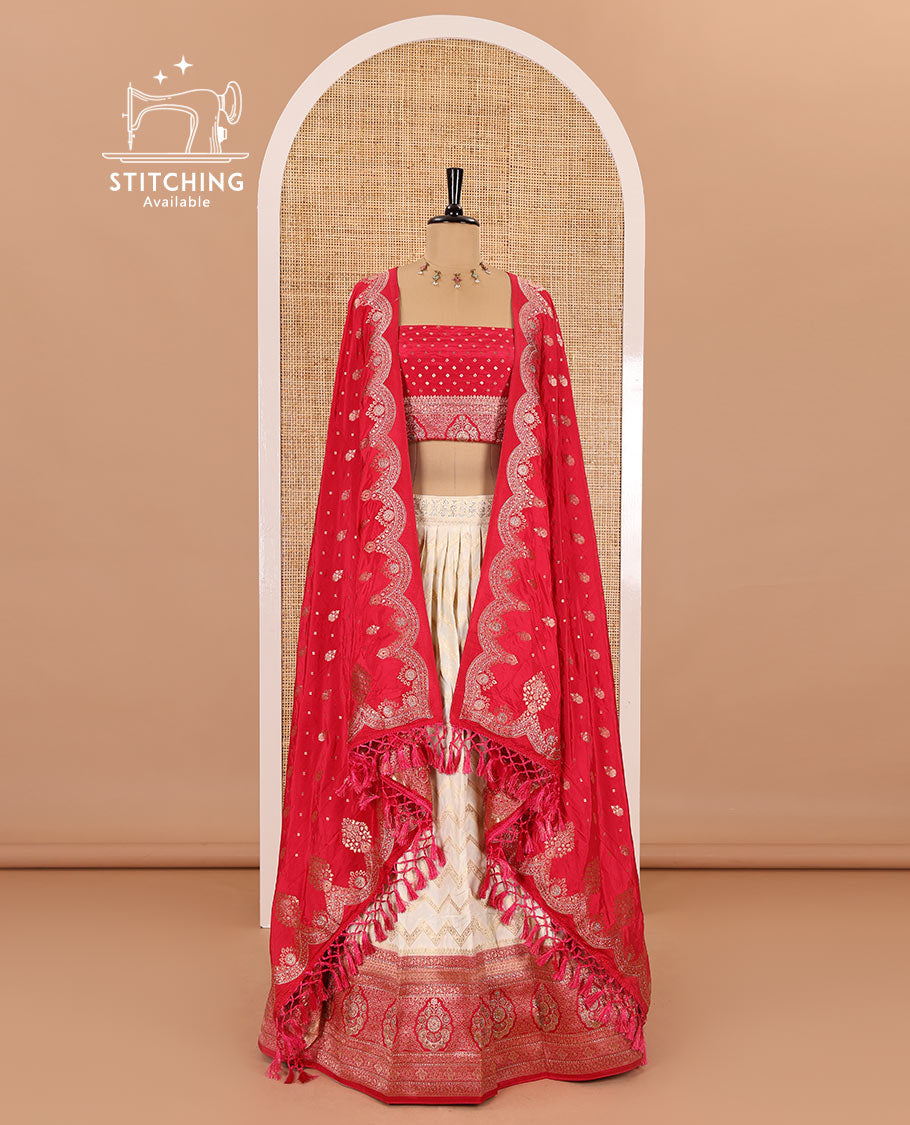 Cream-pink chiniya crepe half-saree, chevron zari jacquard with contrast intricate patterned stone work bordered skirt, contrast blouse, and a scallop bordered intricate dhavani