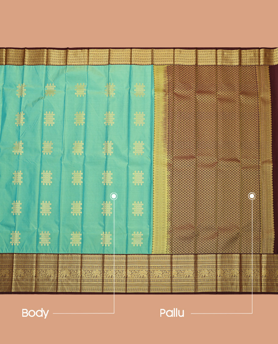 Green Budget Silk Saree, Adorned with Kolam Buttas, Complemented by a Contrast Traditional Zari Border, Grand Pallu, and a Contrast Blouse
