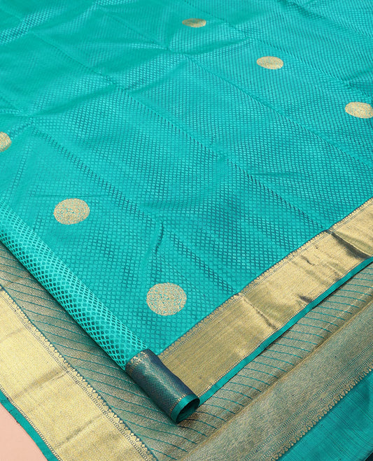 Blue Embossed Parampara Silk Saree, Features Zari Buttas, a Zari Border of Thilakam, Muthu, and Vanki Designs, Grand Pallu, and a Matching Blouse